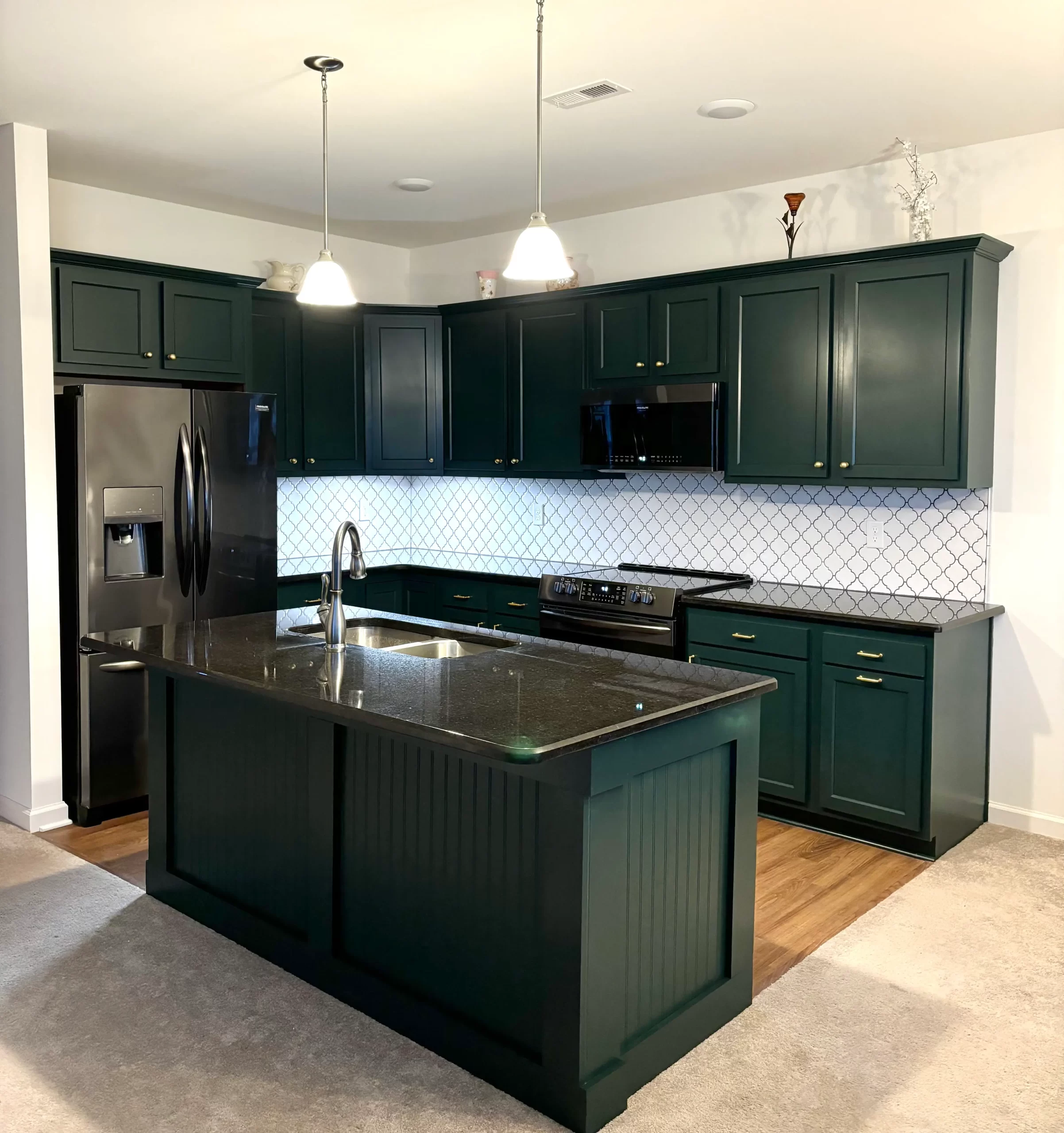 Black Evergreen Kitchen with white backsplash